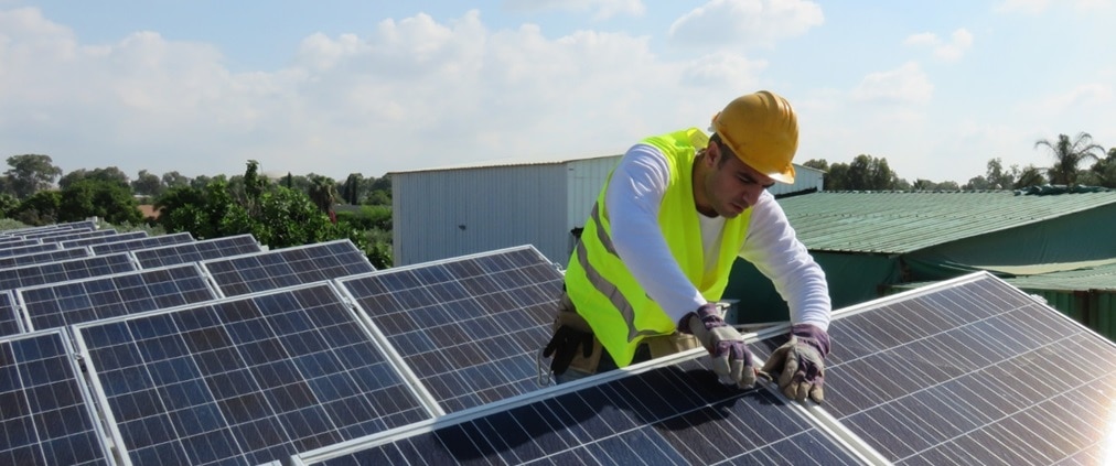 Worker on solar panels