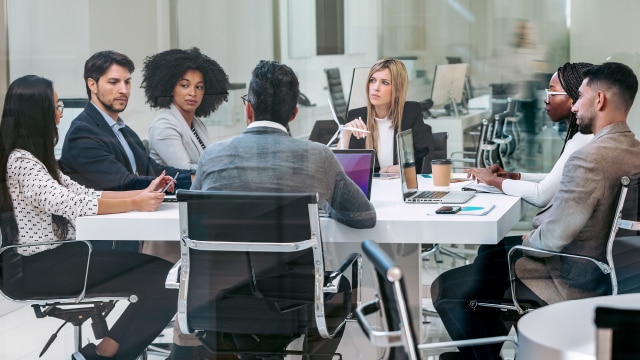 Executives talking in a board room